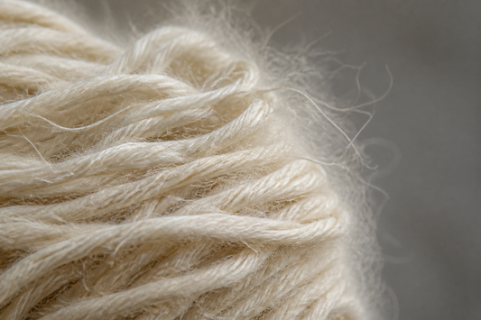 Macro photograph of fine ivory cashmere fibres
